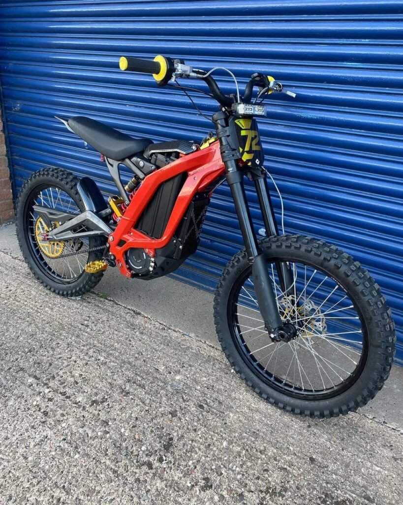 Buy the Mad Man Mechanics 2025 Surron Light Bee with Manitou Dorado forks, Hope brakes, carbon upgrades, gold custom parts, and only 12 miles from new.