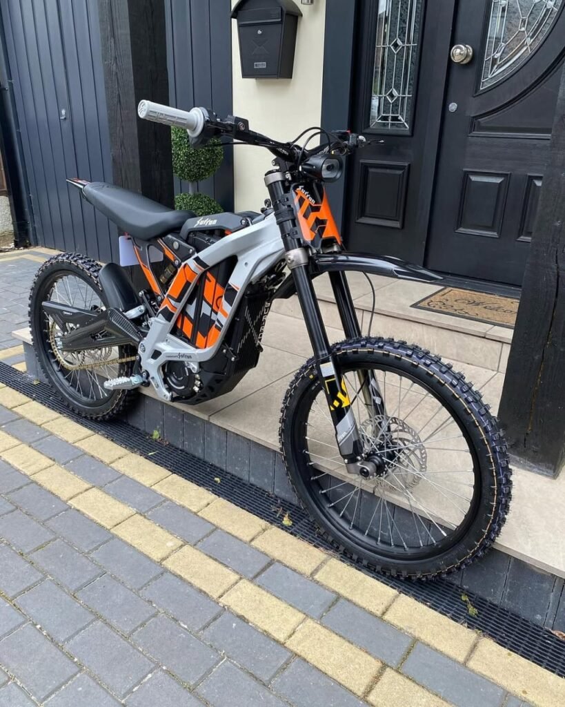 Buy the Mad Man Mechanics 2025 Silver Surron LBX with 0 miles, carbon swingarm covers, charger, manuals, tool kit, diagnostic cable, and nationwide shipping available.
